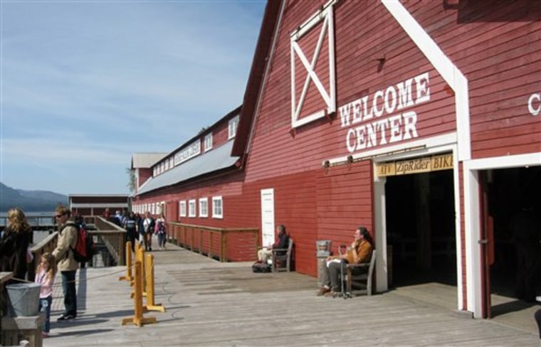 Tourists are shown in front of the welcome center May 26, 2008, at Icy Strait Point in Hoonah, Alaska. Since opening in 2004, Icy Strait has brought in hundreds of thousands of visitors, including 123,000 people in 2010, according to corporation figures. 